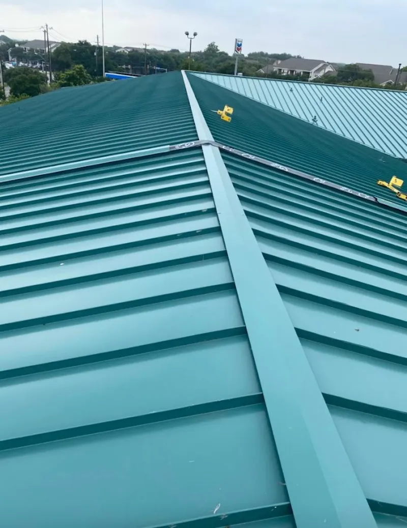 Green commercial metal roof ridge and valley for Metal Roof Repair in Forest Glen